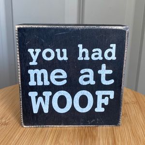 “You had me at woof” pet themed sign.